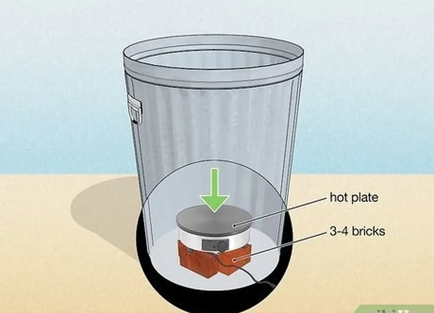 Passo 2 Colocar uma placa de aquecimento no fundo do caixote do lixo.