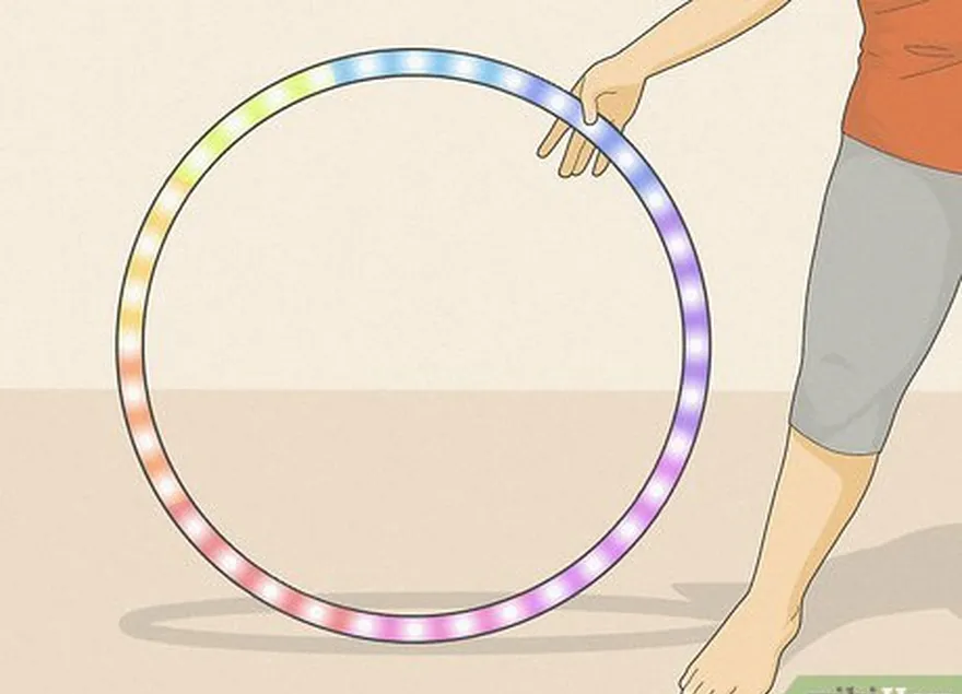 Passo 3 Os arcos de LED e de fogo são também uma opção para aqueles que querem levar o hula hooping para o próximo nível.