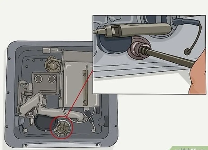 Passo 4 Desaparafusar o depósito's plug or anode rod with a socket wrench.