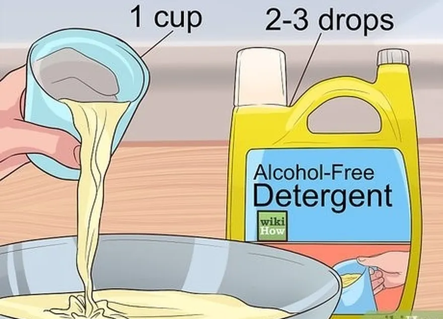 Passo 1 Esfregue as luvas com uma solução de água morna e detergente.