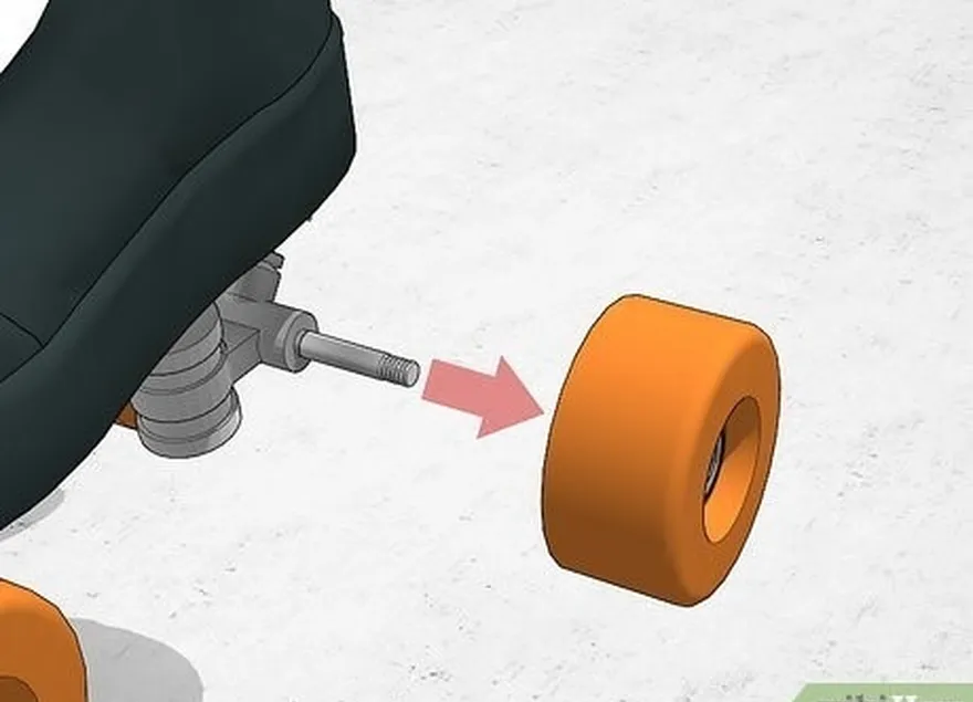 Passo 2 Deslize as rodas para fora dos eixos e coloque-as numa superfície de trabalho plana.