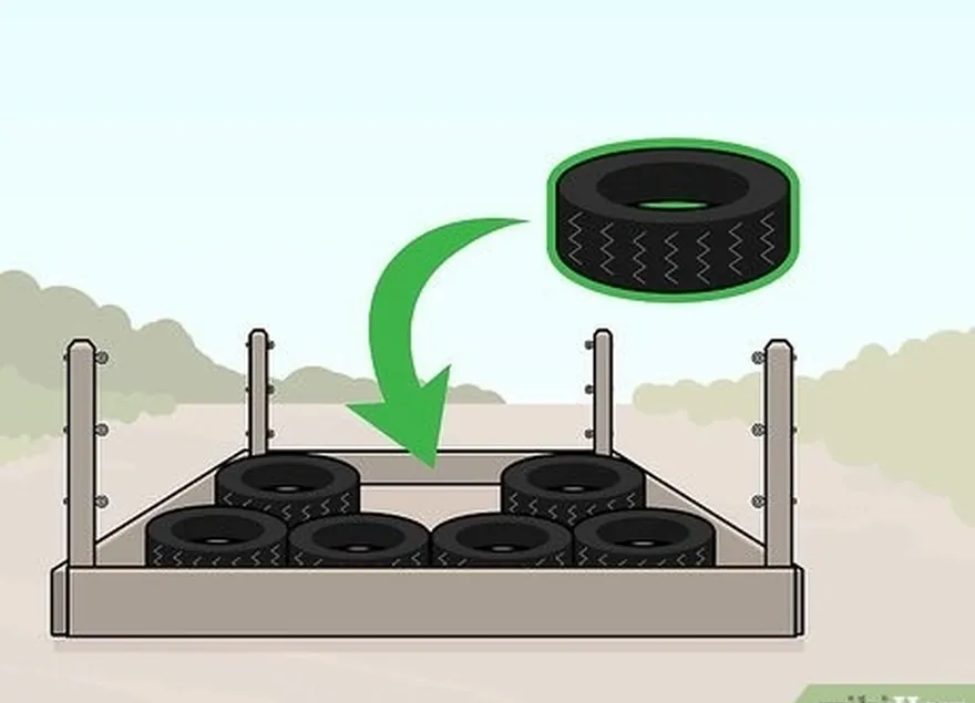 Etapa 1 Forre a parte inferior da estrutura do ringue de luta livre com pneus ou colchões.