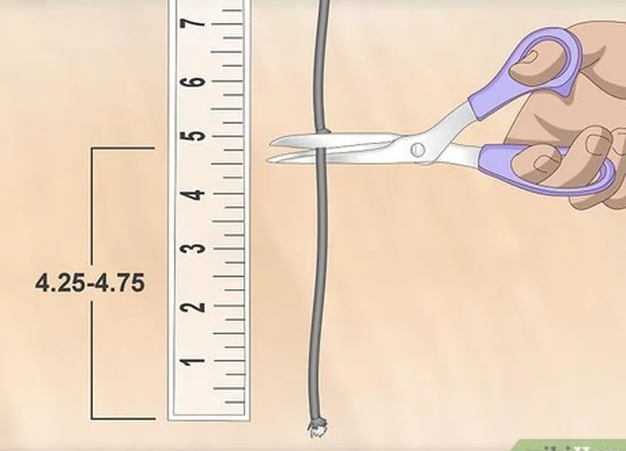 Etapa 2 Corte um comprimento de cordão D-loop com cerca de 10,8 a 12,1 cm (4,25 a 4,75 polegadas).