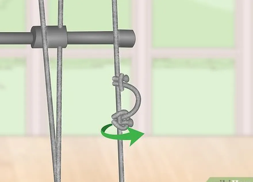 Etapa 5 Enrole a extremidade solta ao redor da corda e volte pelo laço central.