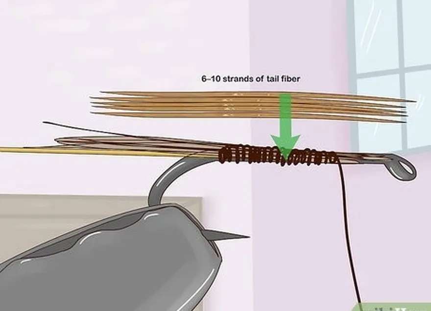 Etapa 3 Amarre de 6 a 10 fios de fibra da cauda na haste do gancho.